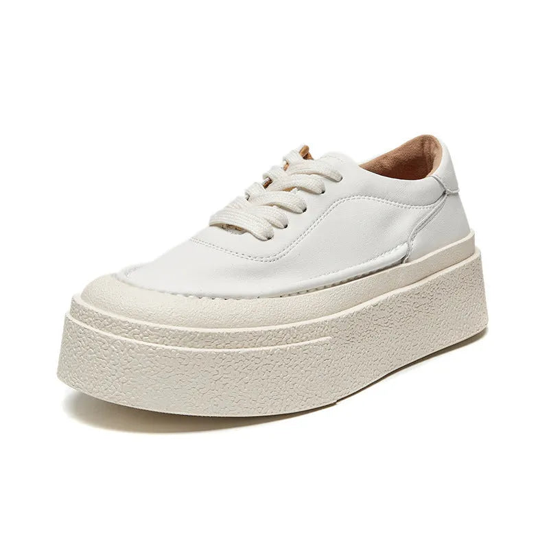 Women's black platform casual shoes with round toe and tied laces on a rubber sole.