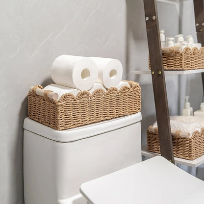 Woven paper storage basket in khaki colour, dimensions 35.5x16x10cm, on a desktop with remote controls and stationery