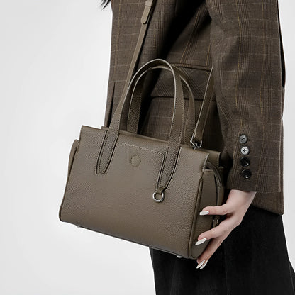 Genuine cowhide leather crossbody bag in a horizontal square shape with a single strap.