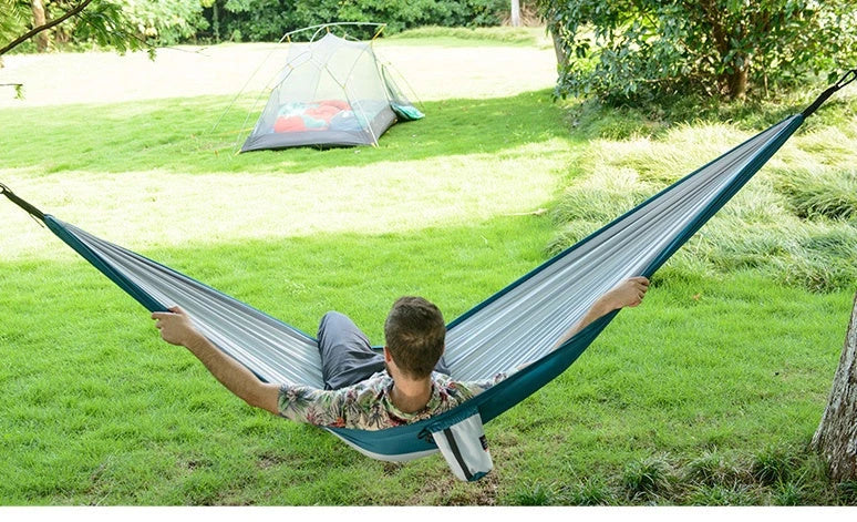 Premium double hammock made with soft, breathable fabric and reinforced ropes for outdoor use