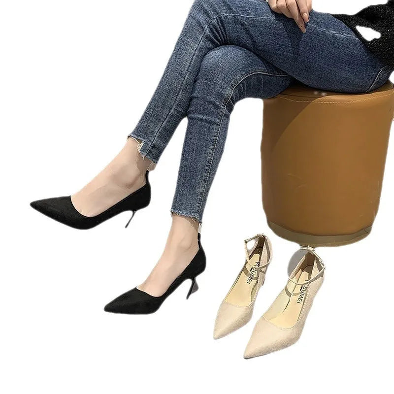 Women's black stiletto heel pumps with skull pattern and buckle detail, showing 8cm heel height