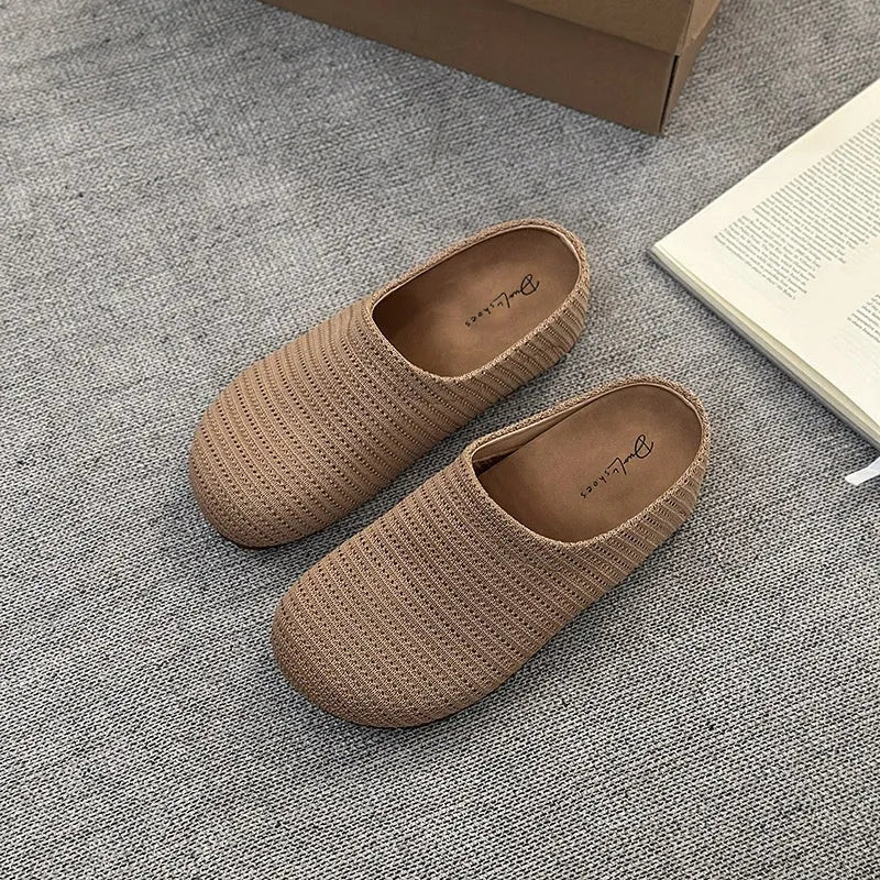 Baotou Boken women's cloth upper slippers with rubber sole in beige, shown in a leisure setting.