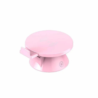 Small white plastic wireless phone charger holder with Bluetooth speaker, 12 × 10 × 6 cm, USB cable included