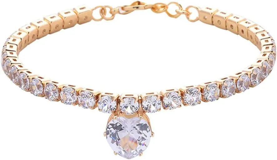 A heart-shaped rhinestone pendant on a gold plated adjustable collar for a small dog, showing the buckle and extension chain.