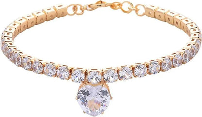 A heart-shaped rhinestone pendant on a gold plated adjustable collar for a small dog, showing the buckle and extension chain.