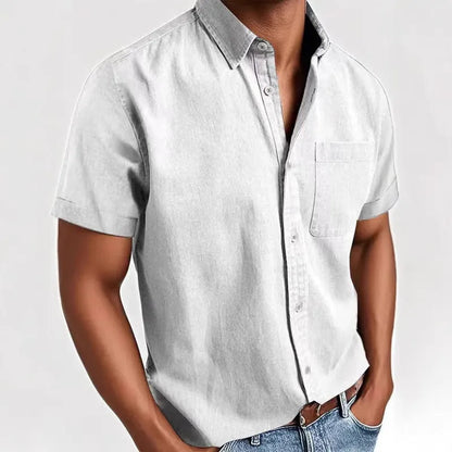 Man wearing a grey loose-fit short sleeve cardigan style shirt