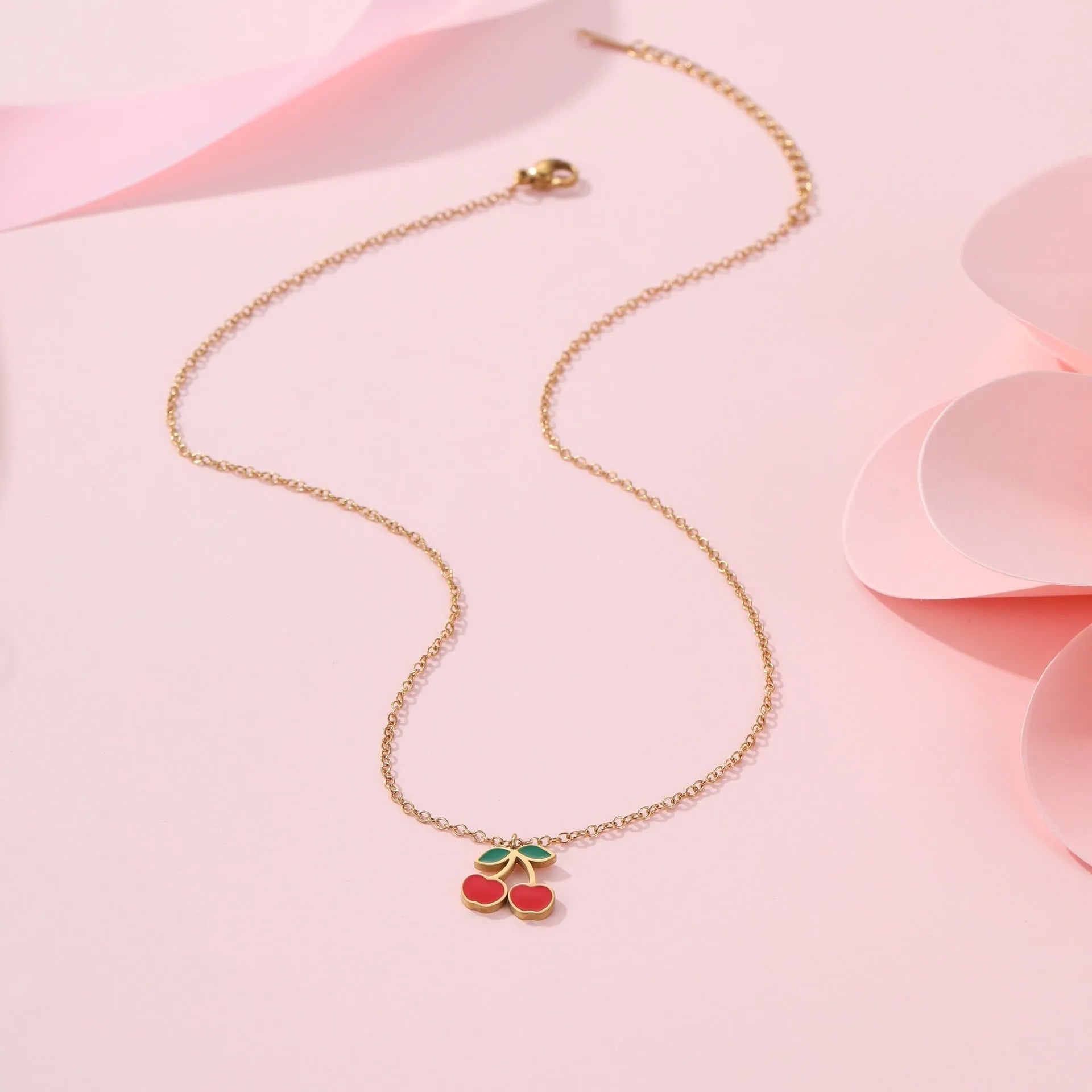 Cherry jewellery set with necklace, bracelet, earrings and ring in gold electroplated stainless steel with geometric fruit design
