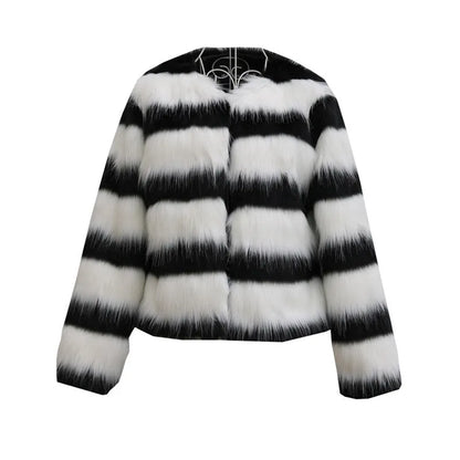 Womens black and white striped long-sleeved faux fur leather jacket on a hanger.