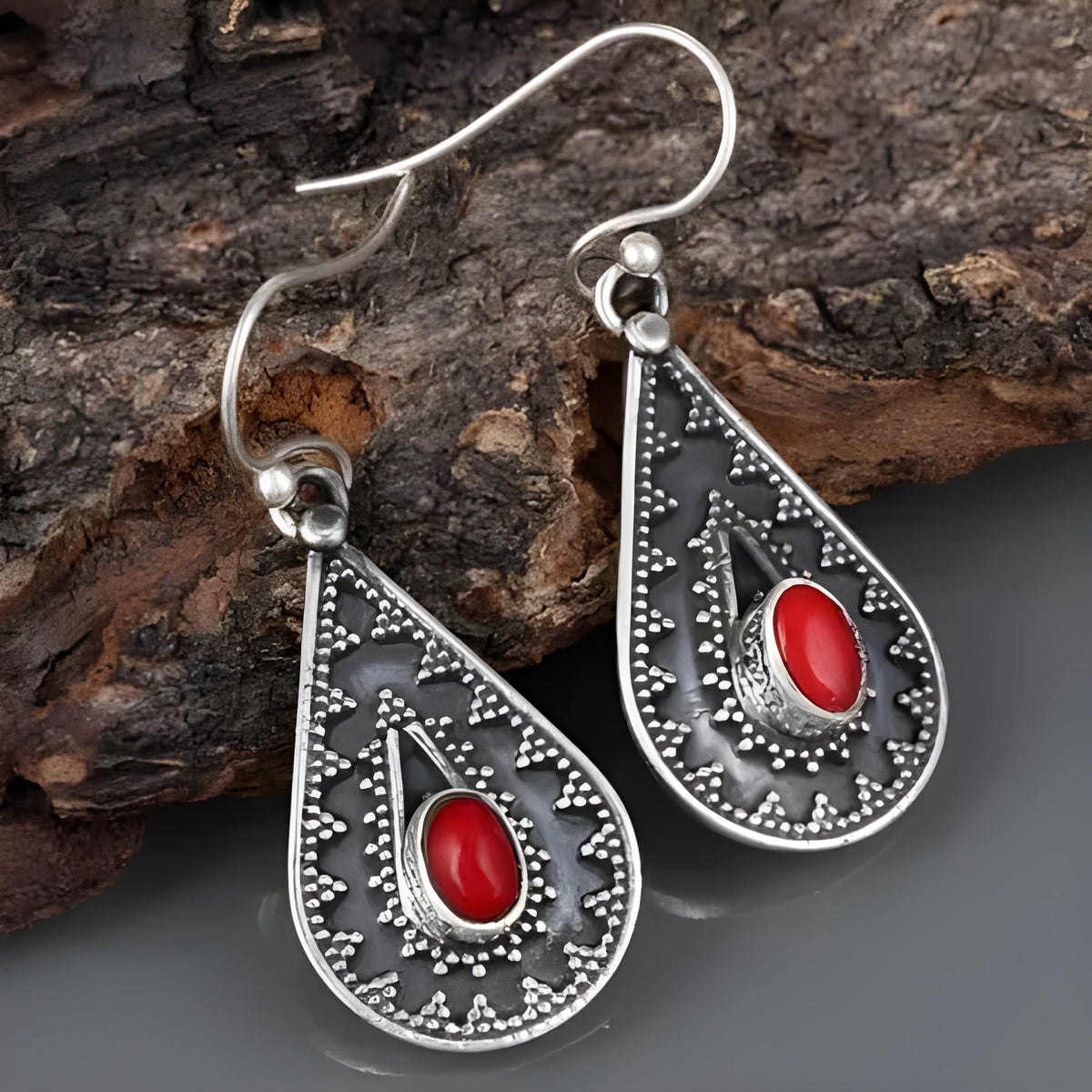 Silver drop-shaped earrings with red pine gemstone details and European American national style design