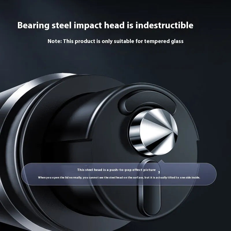 Gun grey aluminium car safety hammer with seatbelt cutter on a 3M rubber base next to a test glass.