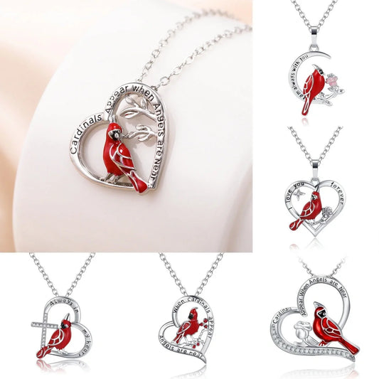 Elegant heart-shaped cardinal pendant necklace with a silver finish, perfect for gifting.