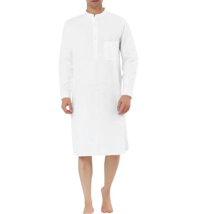 Man wearing a dark blue cotton shirt robe with button front, long sleeves, and side pockets.