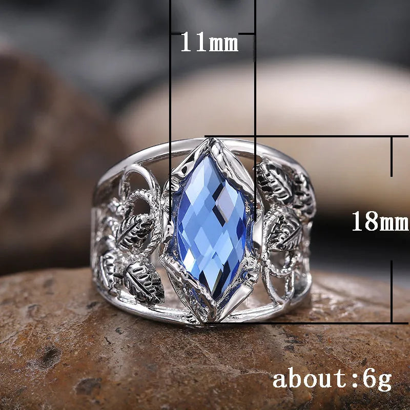 Blue horse eye-shaped crystal ring in alloy metal with geometric design on finger
