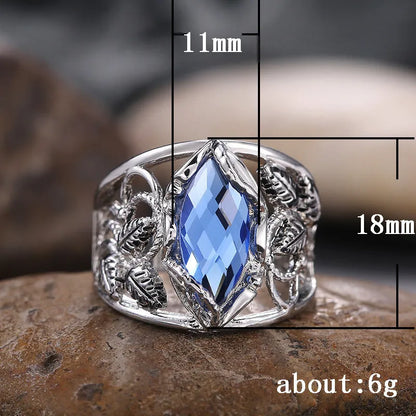 Blue horse eye-shaped crystal ring in alloy metal with geometric design on finger