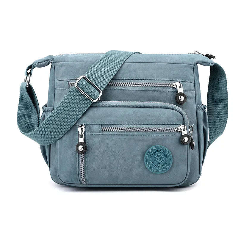Soft nylon messenger bag in square vertical shape with adjustable shoulder strap