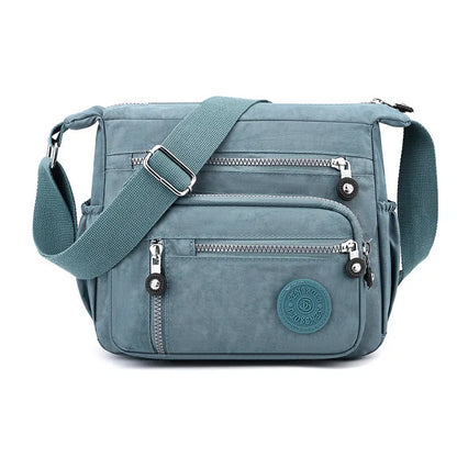 Soft nylon messenger bag in square vertical shape with adjustable shoulder strap