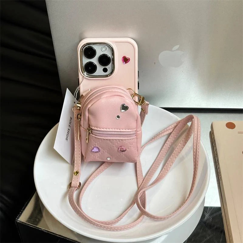 Crossbody Wallet Phone Case for ApplePhone in white, black, and pink with removable strap
