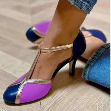 Women's round toe high heel shoe with button closure, shown in light blue pink colour.