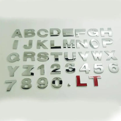 Metal zinc alloy car bumper sticker letters showing 3D design in black and silver finishes