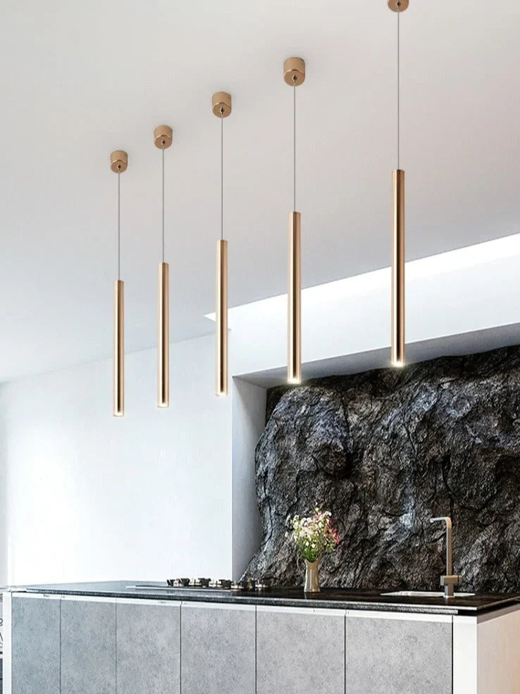 Gold cylindrical chandelier with iron construction and PMMA lampshade in multiple size options from 3.2x30cm to 6x80cm