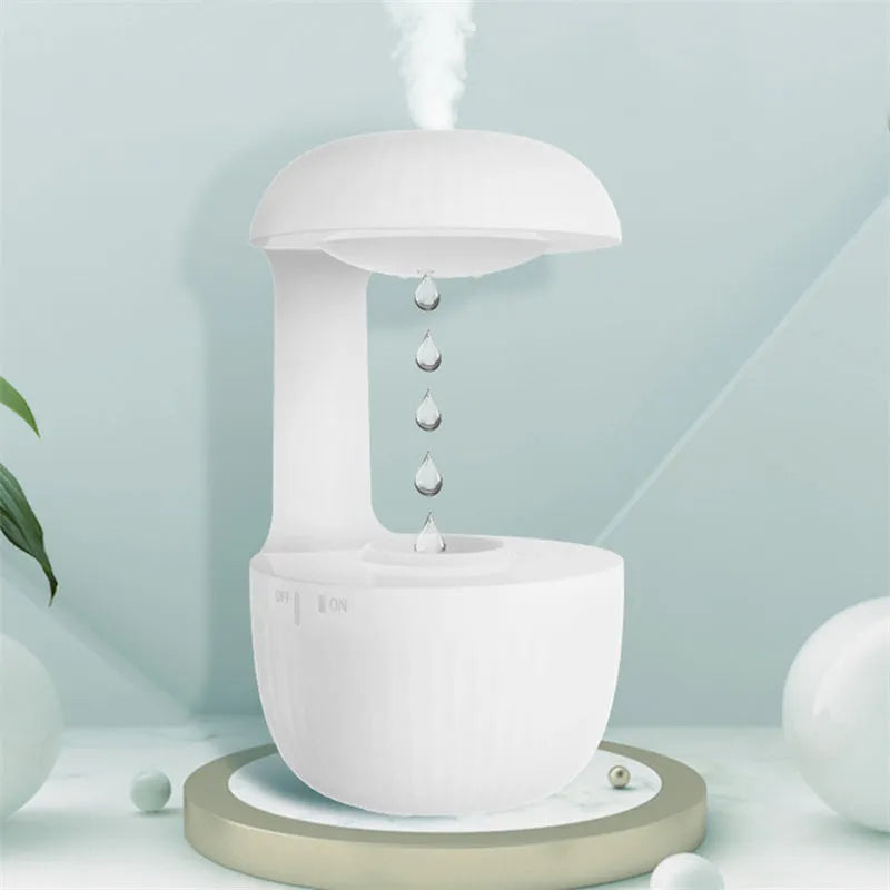 White anti-gravity humidifier showing water droplets appearing to levitate upwards from its base