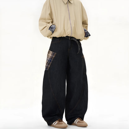 Loose straight-leg cotton trousers in a red plaid pattern, laid flat.