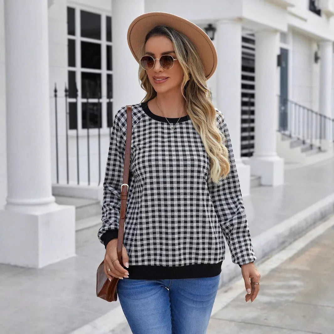 Black plaid pullover sweater with striped pattern and long sleeves, showing printing detail on polyester fabric