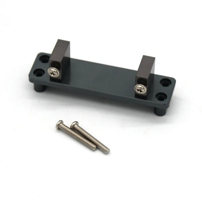 Grey alloy remote control car parts including front bar, beam, axles, and motor housing for 1:24 scale military model builds