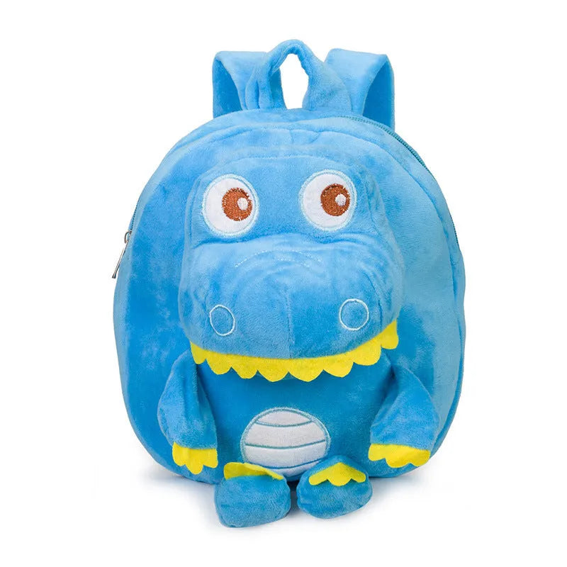 Soft blue plush children's backpack with an embroidered green dinosaur character and a soft handle.