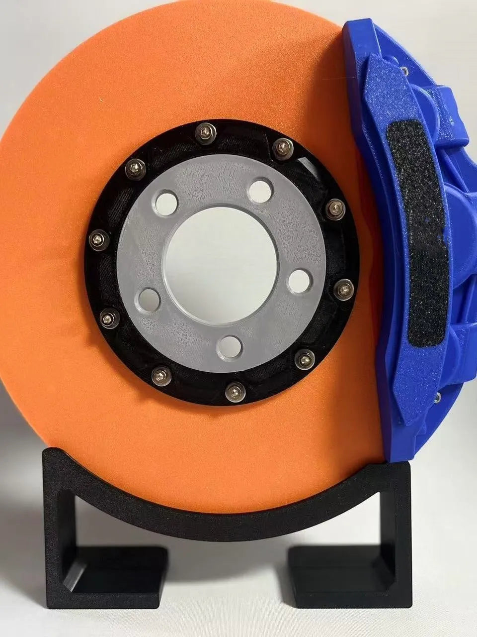 Brake disc design LED night light with caliper details in blue, red, or yellow colour options on desktop