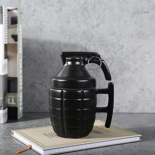 Stylish and durable grenade-shaped ceramic coffee mug with a secure lid, perfect for outdoor adventures and office use.