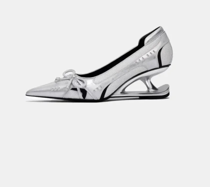 Women's black pointed toe shoes with a distinctive floating Mary Jane heel.