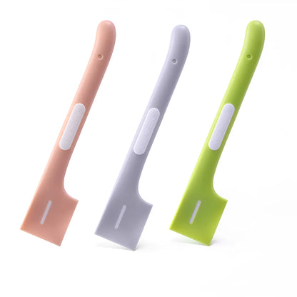 Green long-handle pet feeding spoon with right-angle head for scraping canned wet food.