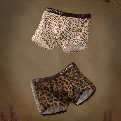 Men's leopard print polyester underwear trunks in mid waist style on a white background.