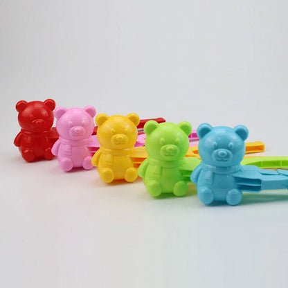 Red heart-shaped snowball maker clip for kids, perfect for winter play