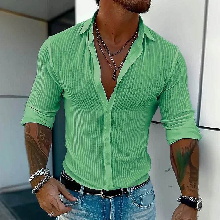 Man wearing a loose fit plain colour striped long sleeve cardigan shirt.