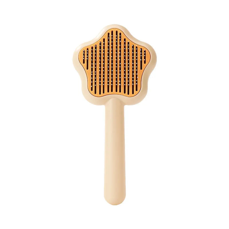 Green and yellow stainless steel self-cleaning cat comb for de-shedding, measuring 20cm.