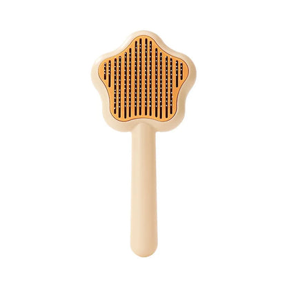 Green and yellow stainless steel self-cleaning cat comb for de-shedding, measuring 20cm.