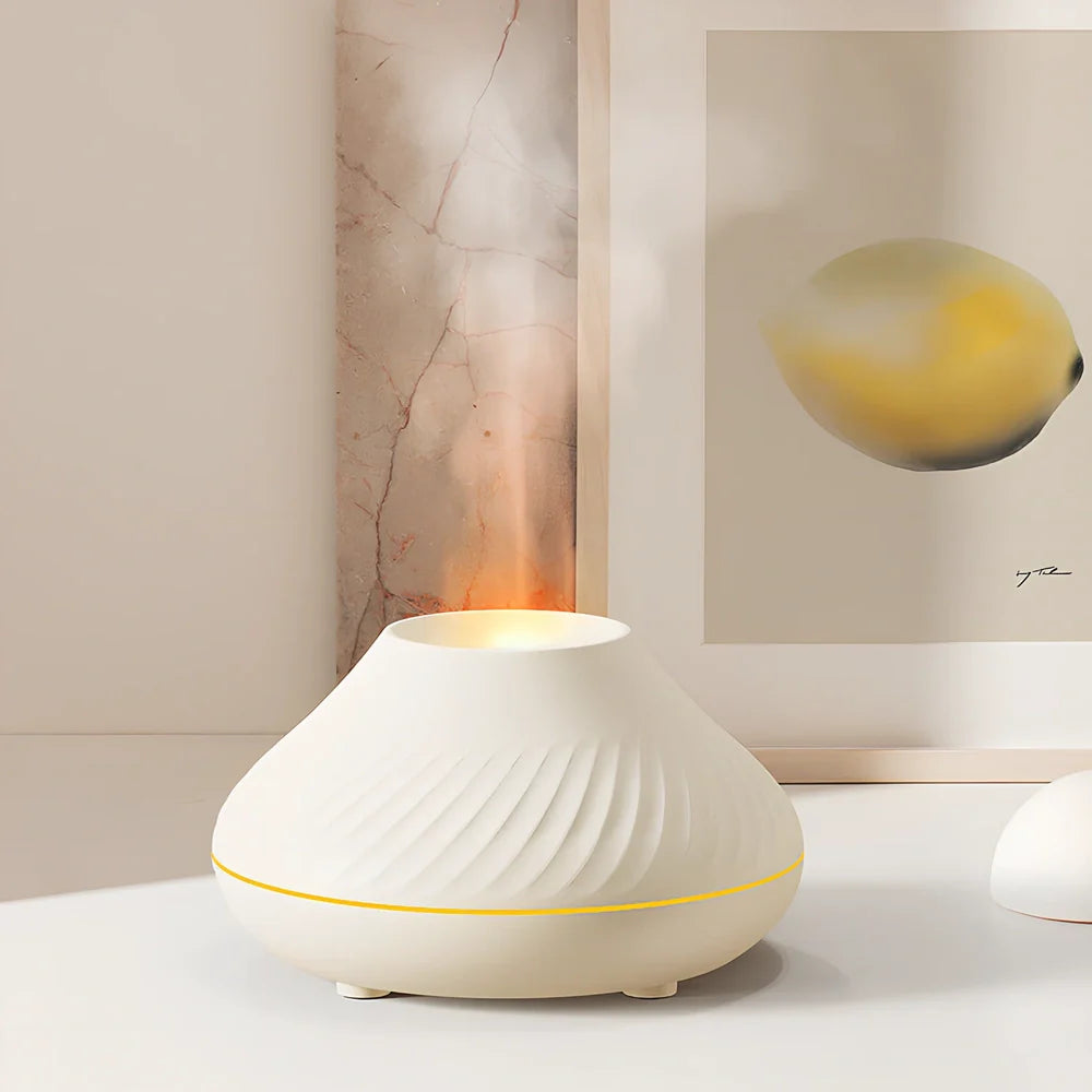 Black RGB flame aroma diffuser 130ml showing 3D colourful volcano mist effect on table