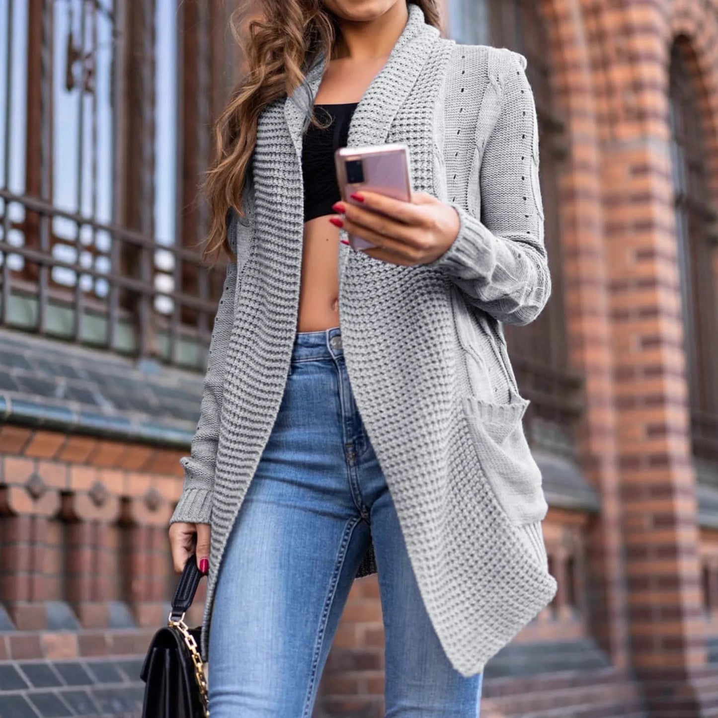 Grey loose-fit women's cardigan coat with long sleeves and side pockets.