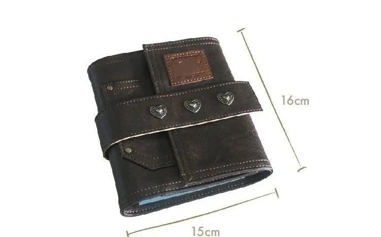 Brown A7 loose-leaf notebook with PU cover and retro buckle design, shown open.