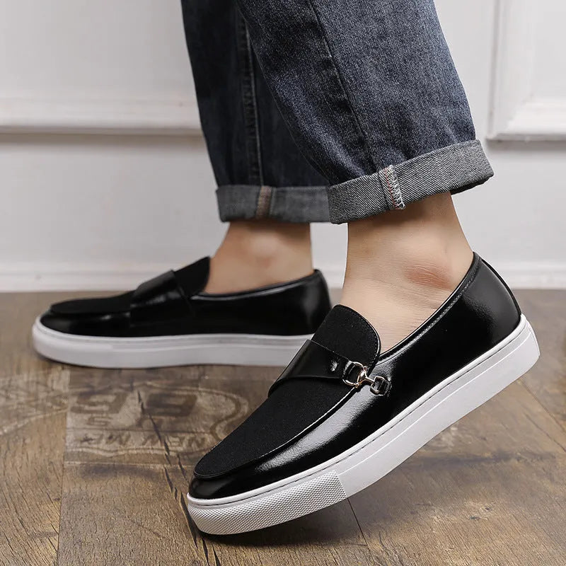 Men's black slip-on shoes with a gold horsebit buckle detail and round toe.