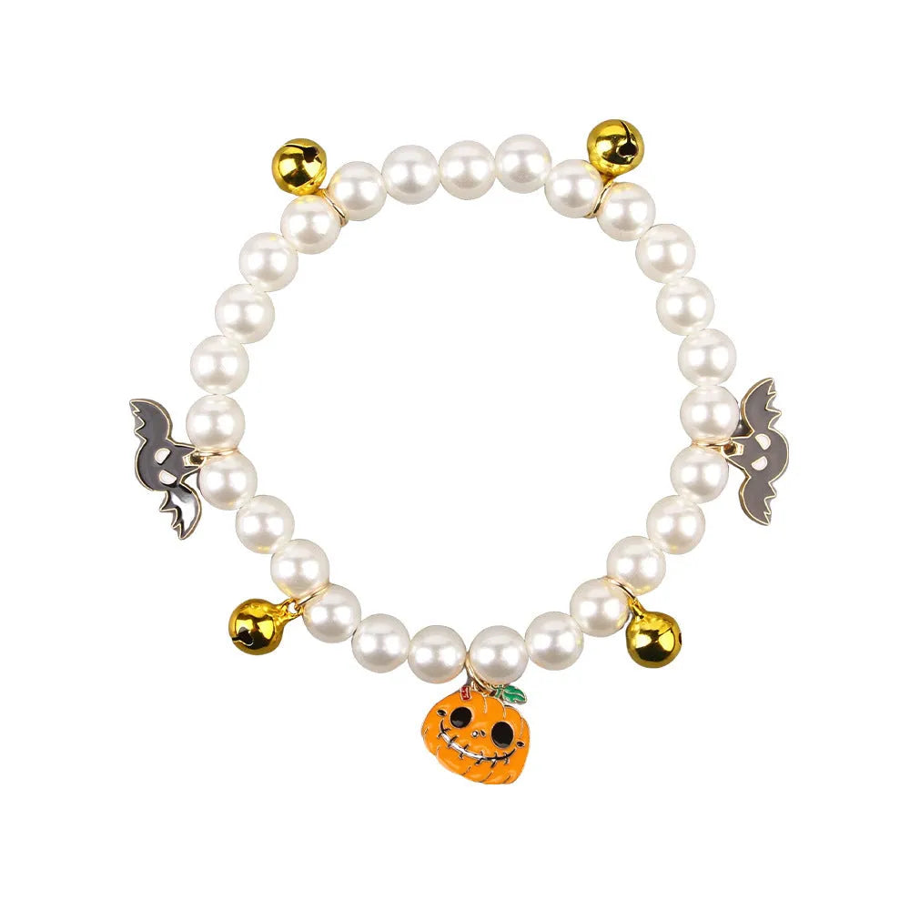 Three pearl necklaces with bells for pet Halloween costumes and decoration