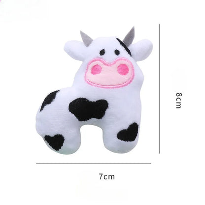 Plush cat toy in cow, crocodile, or parrot shape with colourful fabric and embroidered details.