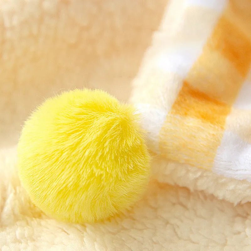 A blue coral fleece pet blanket laid flat, showing its soft texture and rectangular shape as a dog or cat bed mat.