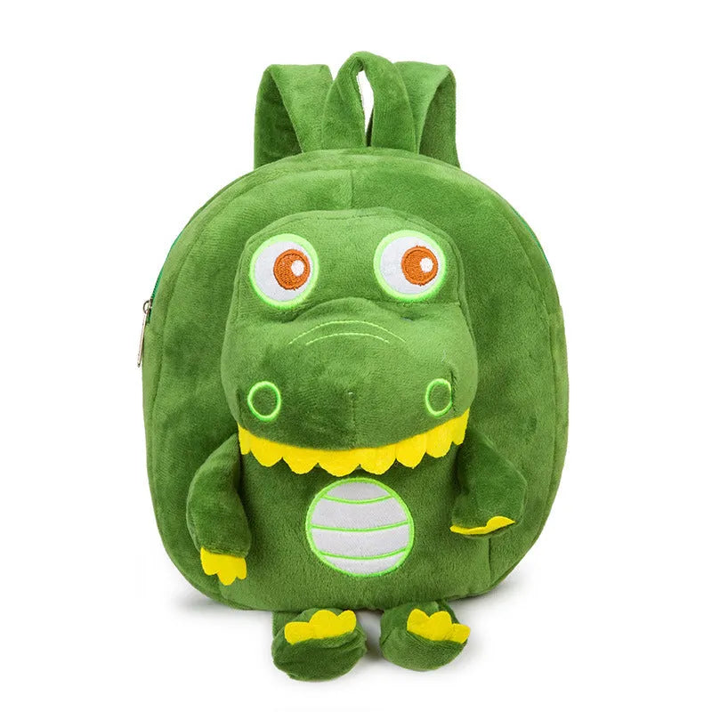 Soft blue plush children's backpack with an embroidered green dinosaur character and a soft handle.