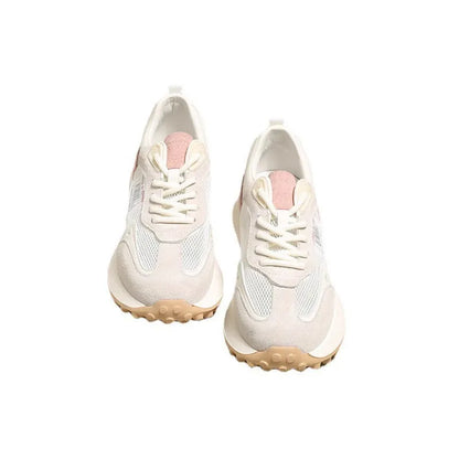 Women's grey low-top retro sneakers with mesh lining and round toe on a flat rubber sole.