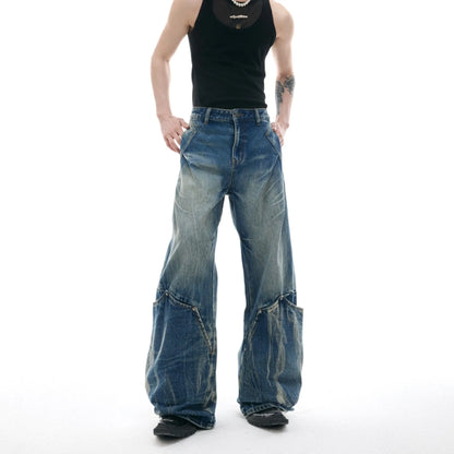 Men's verdant blue jeans with burst pattern, curved knife cut, and loose fit design