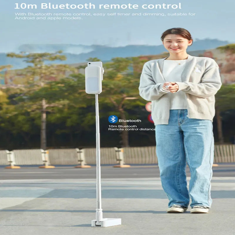 Floor standing fill light with aluminium alloy frame and wireless remote, designed for mobile phone live broadcast streaming with adjustable height, 10000-hour LED lifespan, and 4-12 hour battery runtime for desktop studio setups in pink or white options.