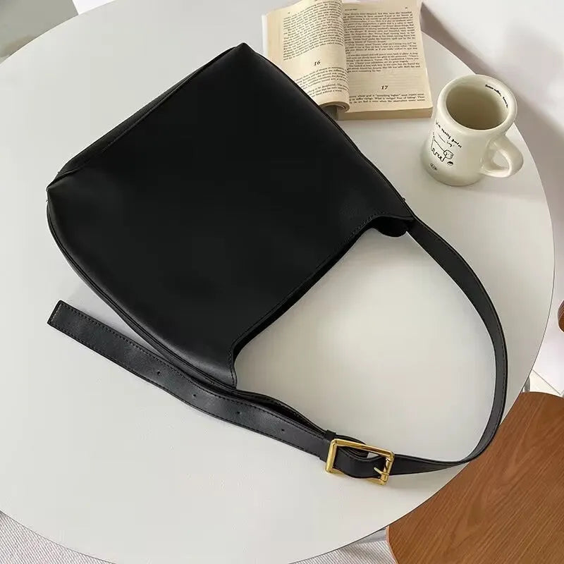 Women's soft PU shoulder bag measuring 28cm by 32cm by 12cm with swing thread details